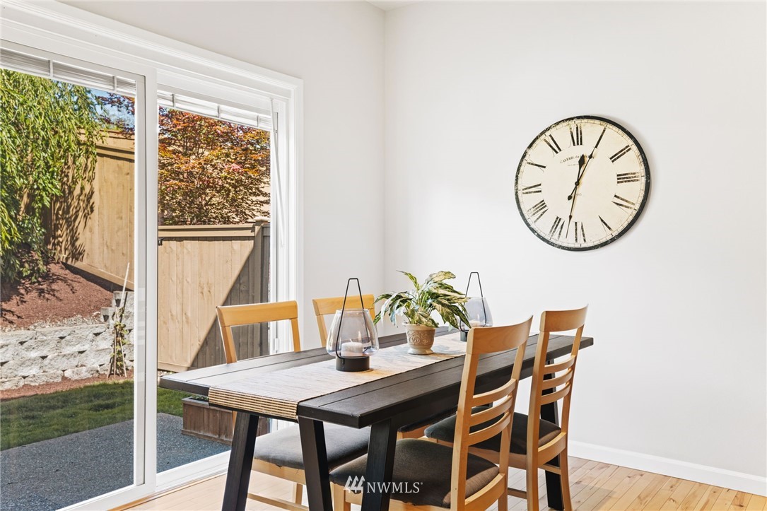 3007 182nd Place Southeast Bothell, WA 98012 - Photo 8 of 33 a view of a dining room with furniture window and wooden floor