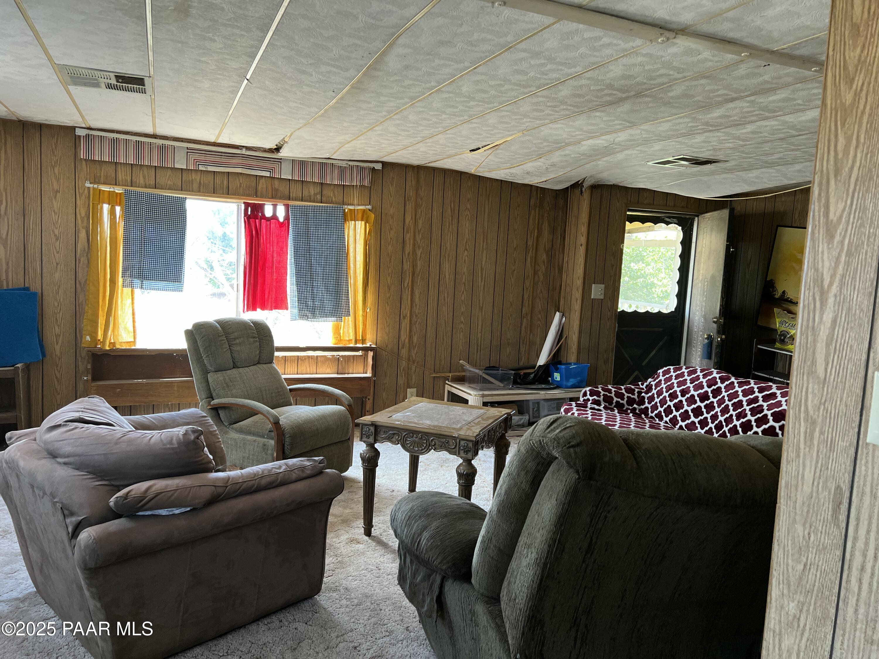 13338 East Main Street Mayer, AZ 86333 - Photo 15 of 15 a living room with furniture and a chandelier