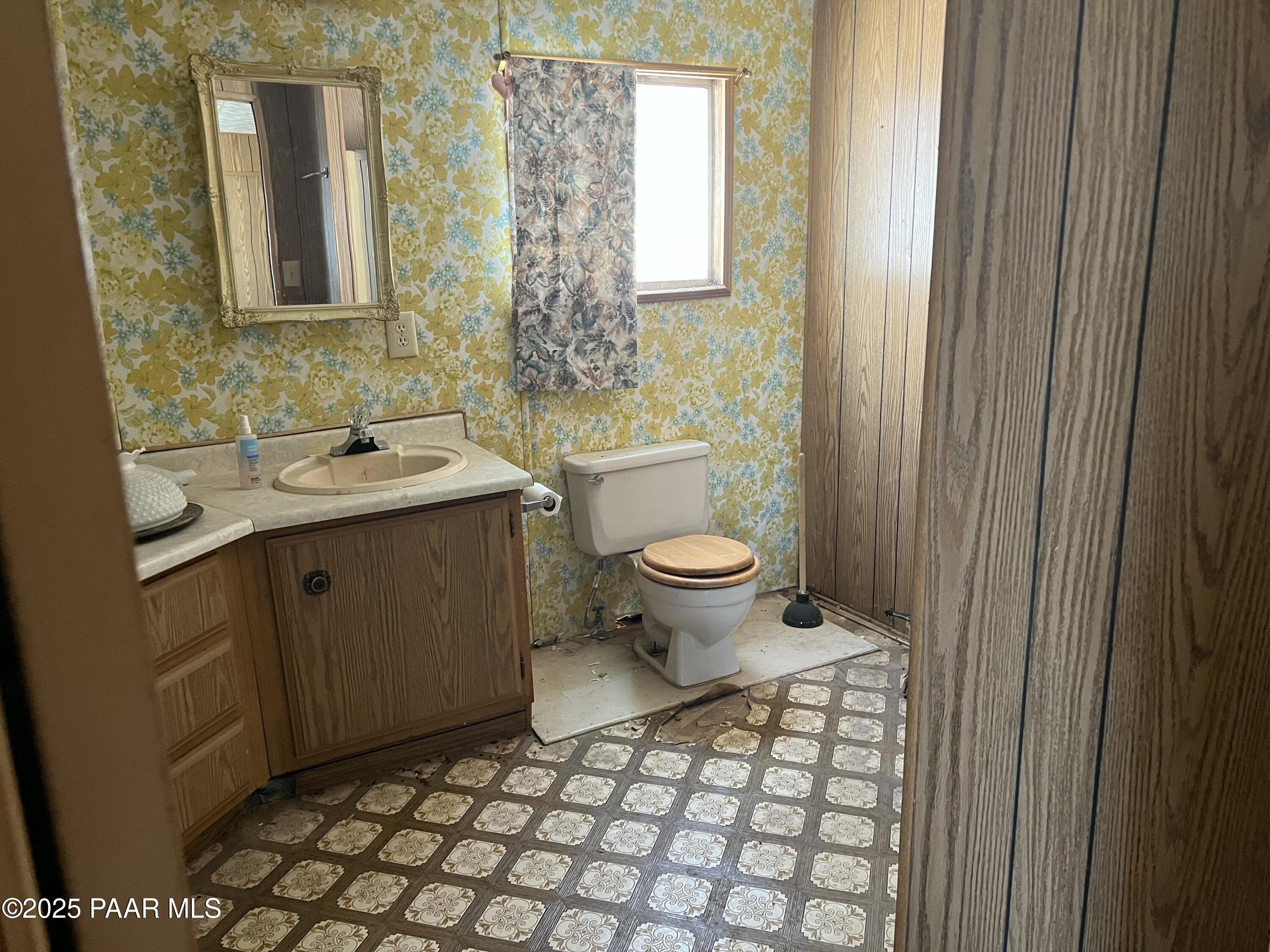 13338 East Main Street Mayer, AZ 86333 - Photo 10 of 15 a bathroom with a sink toilet and mirror