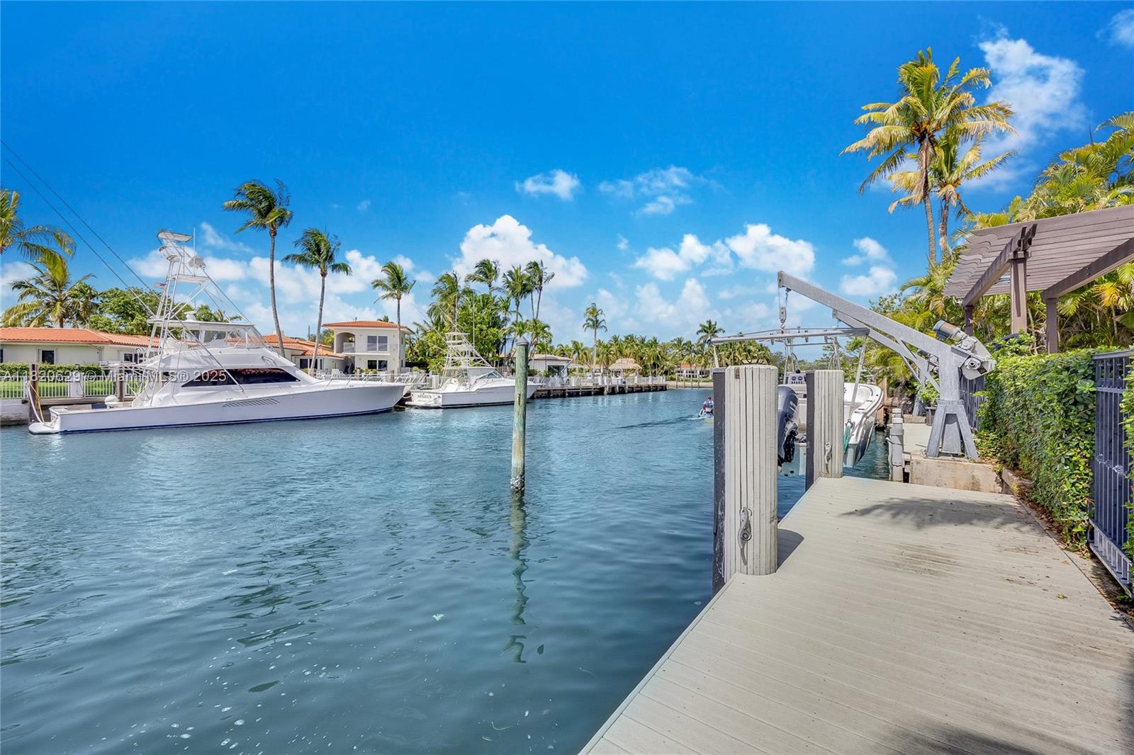 2085 Ixora Road North Miami, FL 33181 - Photo 21 of 28 a view of a swimming pool and outdoor seating