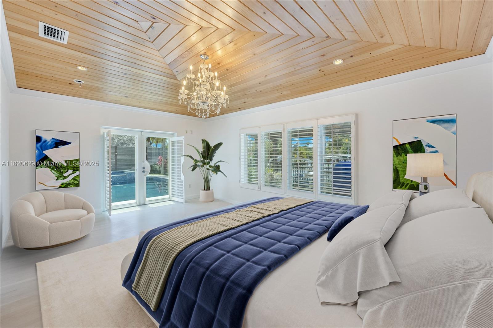 2085 Ixora Road North Miami, FL 33181 - Photo 7 of 28 a bedroom with a bed and a large window