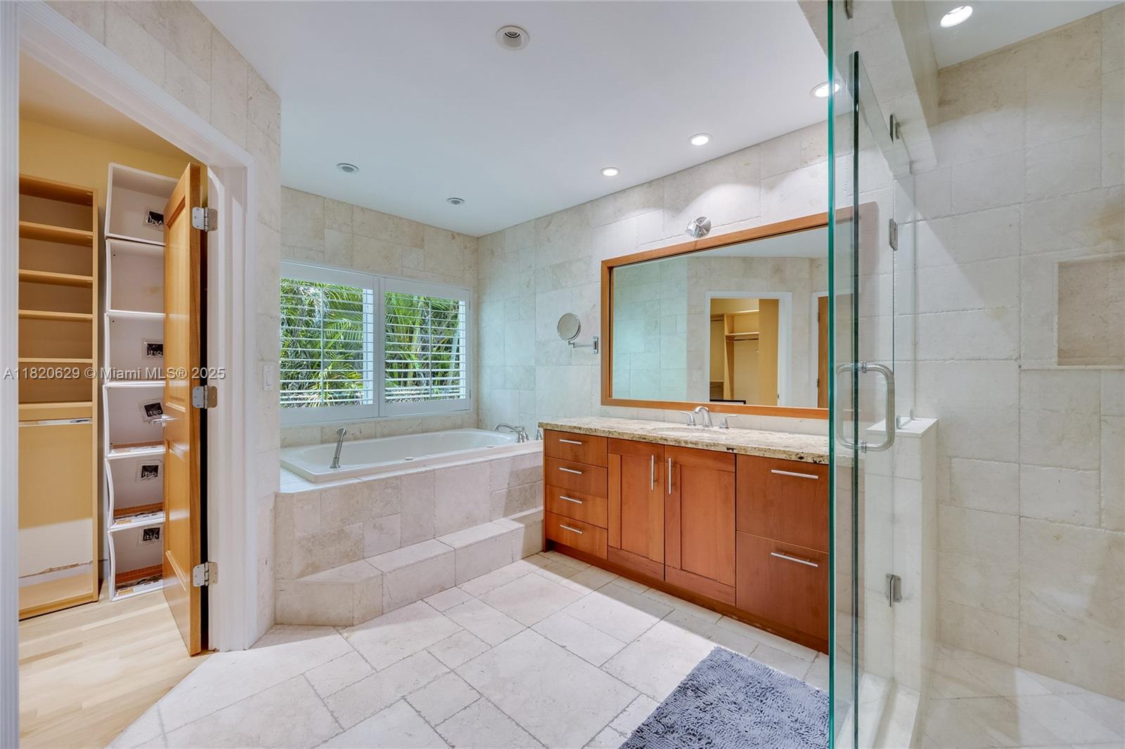 2085 Ixora Road North Miami, FL 33181 - Photo 8 of 28 a bathroom with a tub sink and mirror