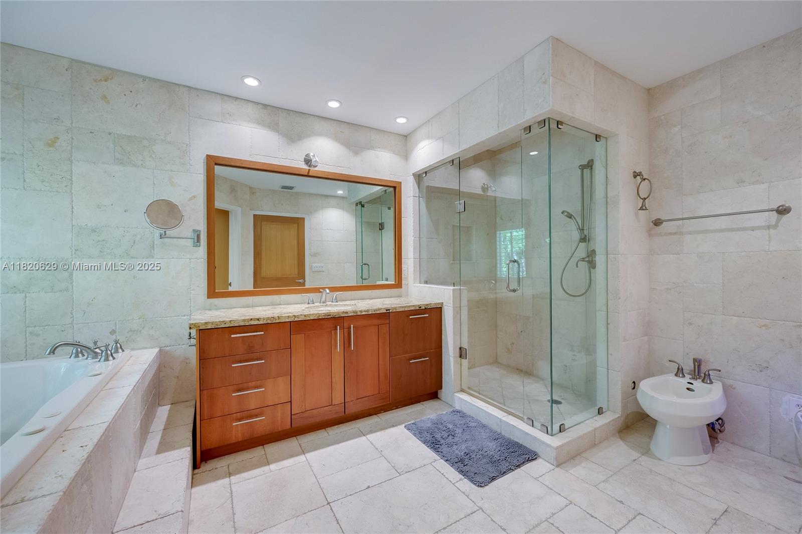 2085 Ixora Road North Miami, FL 33181 - Photo 9 of 28 a bathroom with a double vanity sink toilet and shower