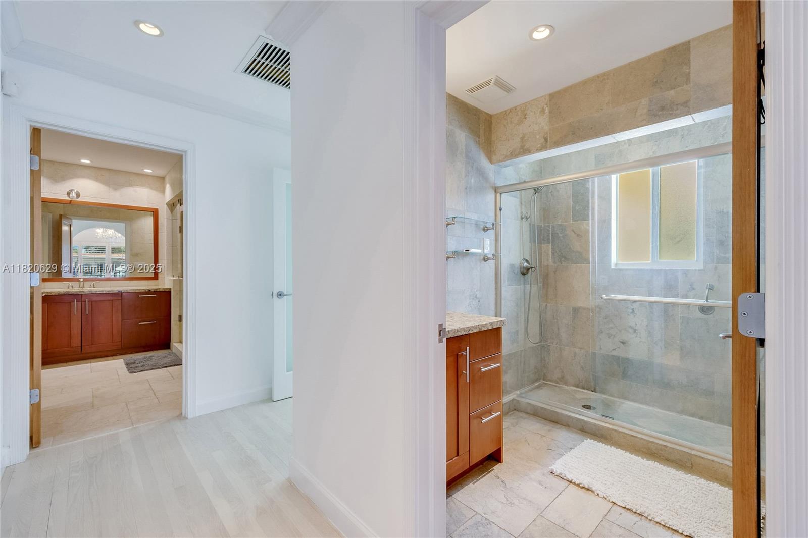 2085 Ixora Road North Miami, FL 33181 - Photo 10 of 28 a bathroom with a bathtub and a shower