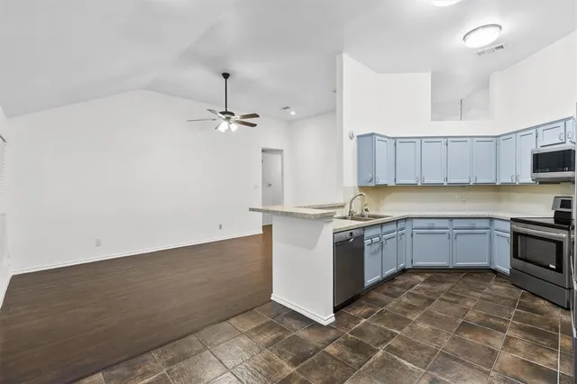 a large kitchen with cabinets