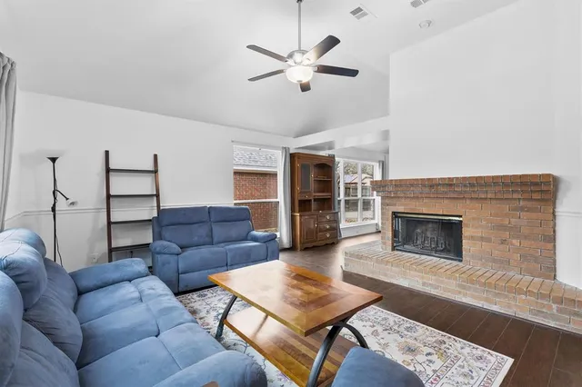 a living room with furniture and a fireplace