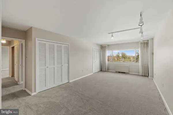 a view of a livingroom with furniture and cabinet