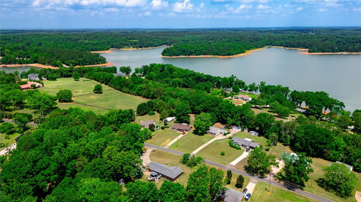 1815 Pearman Dairy Road Anderson, SC 29625 - Photo 34 of 35 Discover a peaceful lakeside community nestled amidst mature trees and scenic waterfront views.