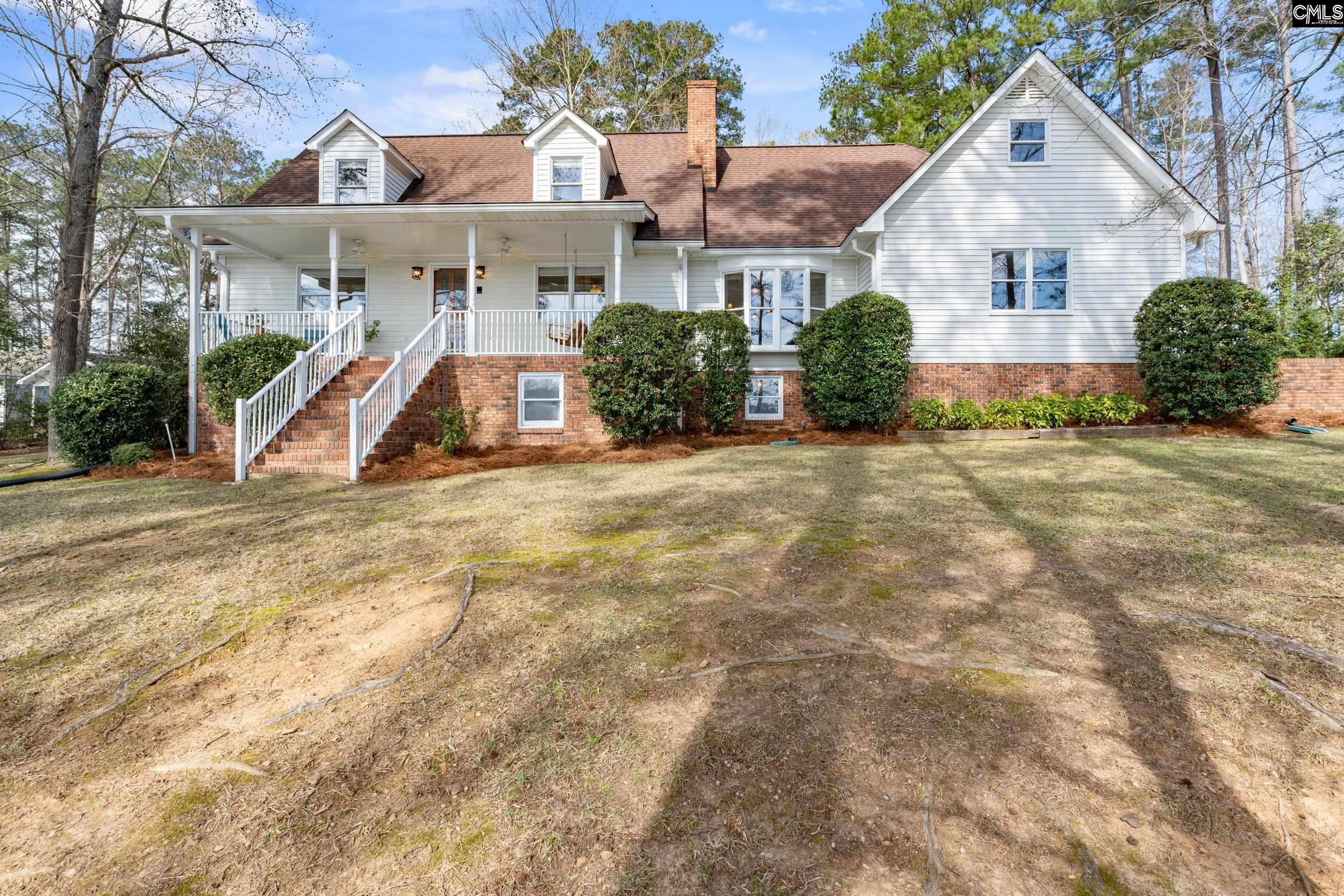 115 Rocky Ridge Road Leesville, SC 29070 - Photo 2 of 51 a view of a white house with a yard and plants