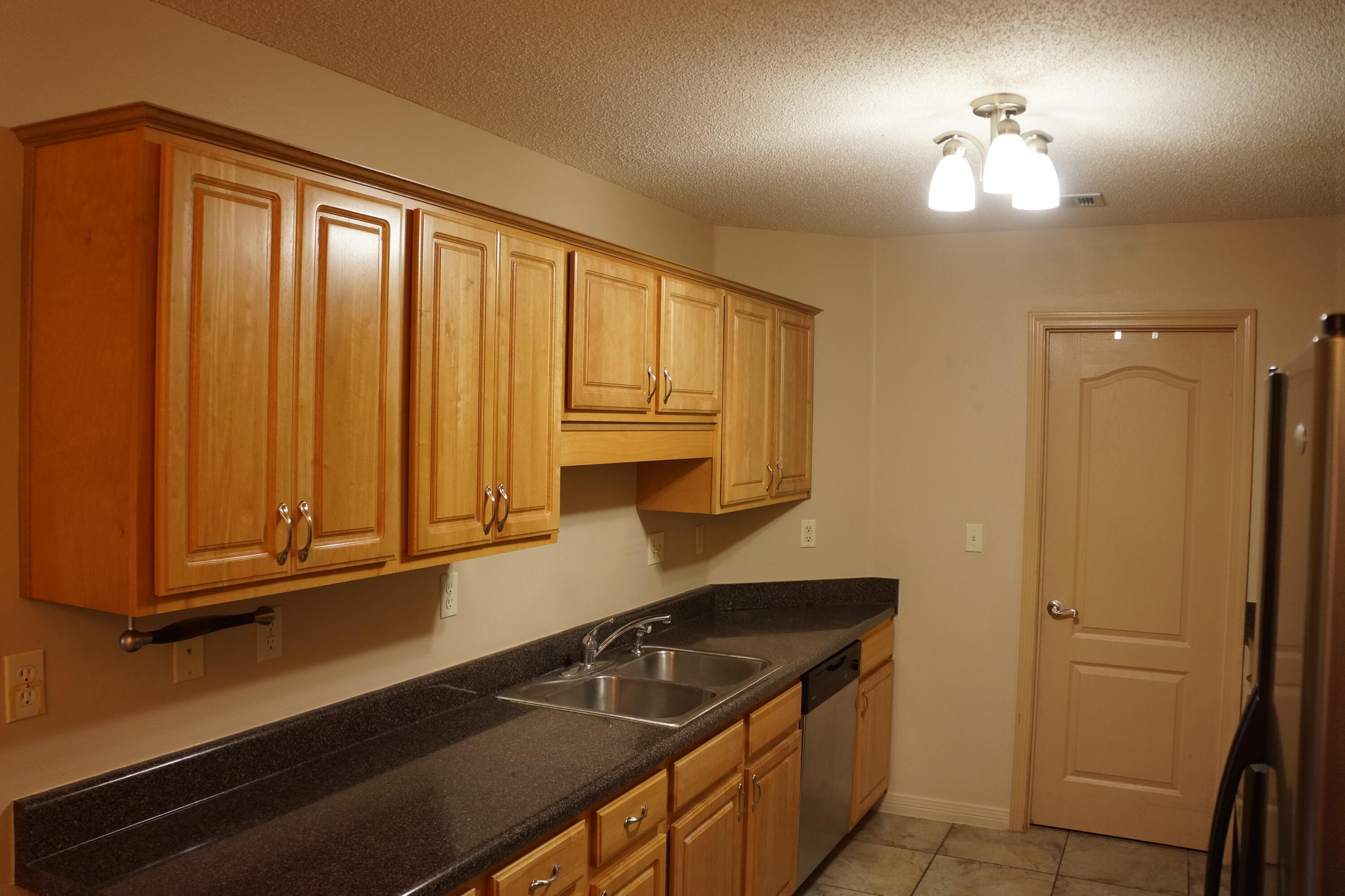 3248 Twilight Drive Crestview, FL 32539 - Photo 7 of 13 a kitchen with a stove and a refrigerator