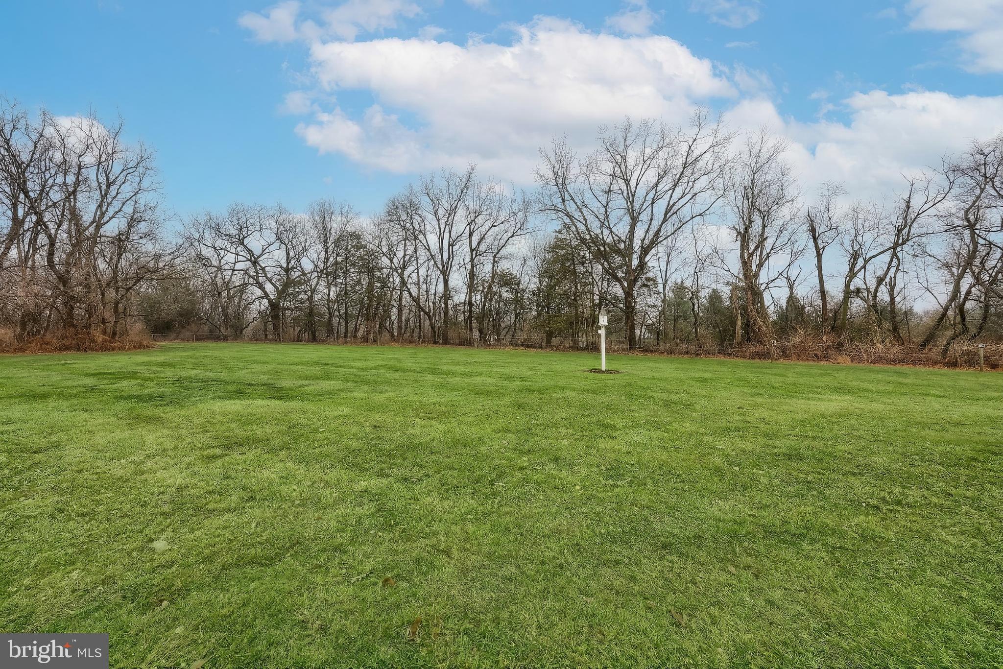 108 Pickett Road Dover, PA 17315 - Photo 18 of 64 a view of a field with trees in the background