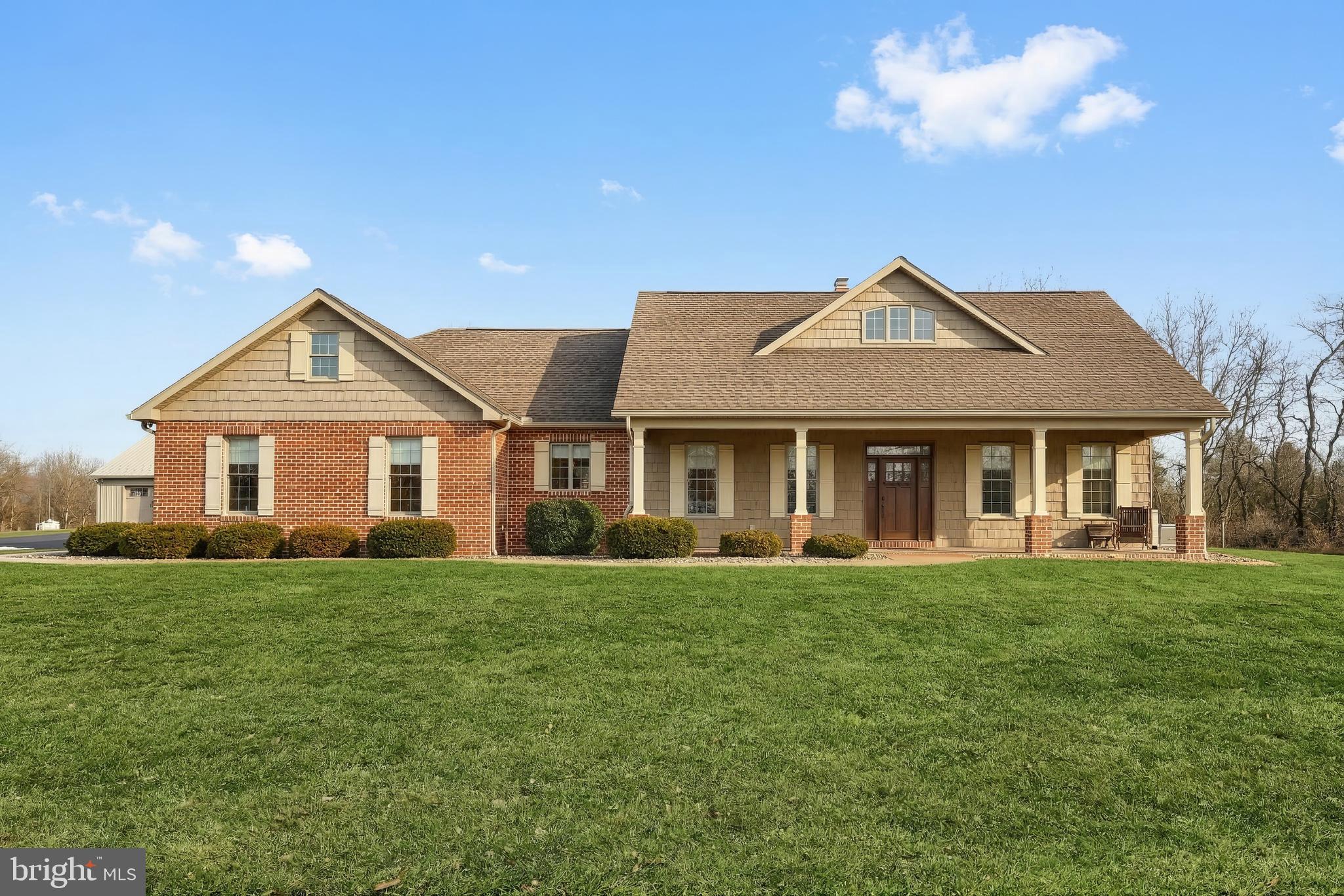 108 Pickett Road Dover, PA 17315 - Photo 3 of 64 a front view of a house with a garden