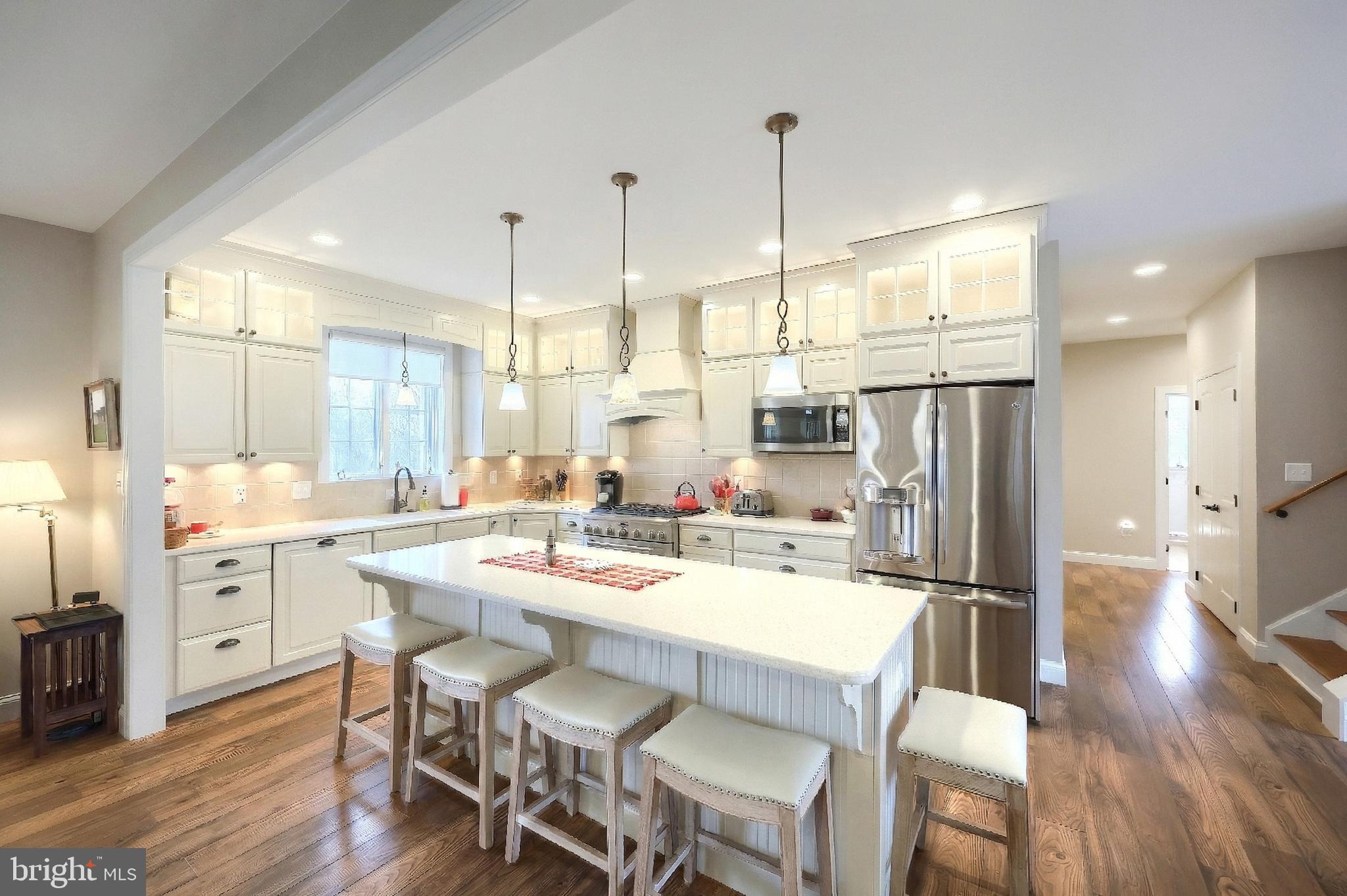 108 Pickett Road Dover, PA 17315 - Photo 43 of 64 a kitchen with stainless steel appliances a dining table chairs and wooden floor