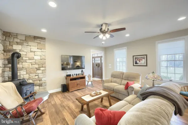 a hallway with a couch and wooden floor