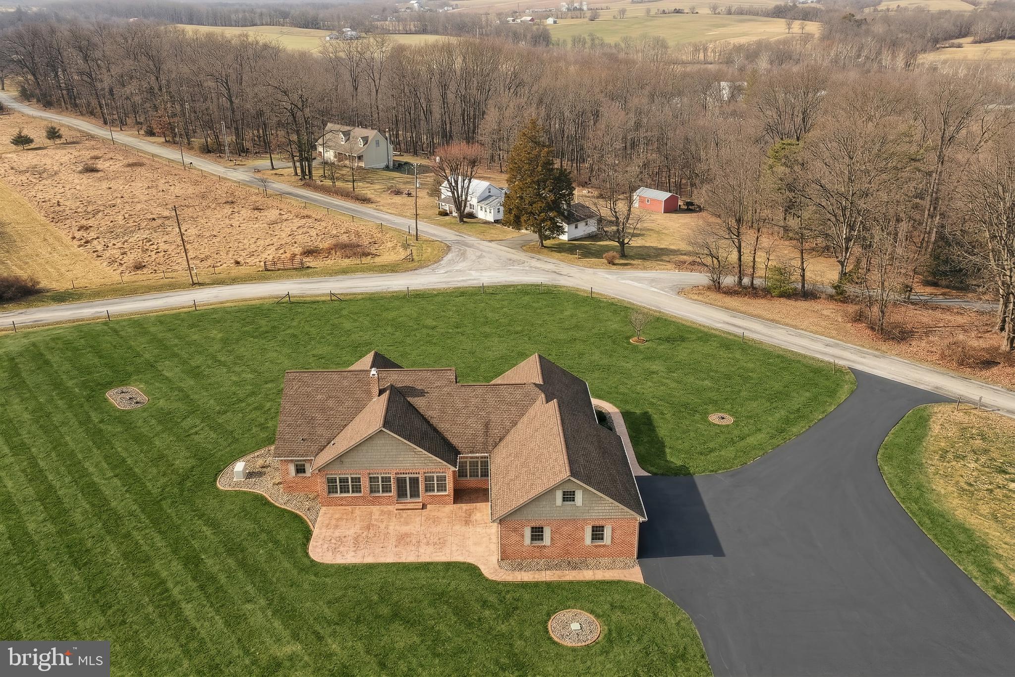 108 Pickett Road Dover, PA 17315 - Photo 9 of 64 an aerial view of a house with garden space and trees all around