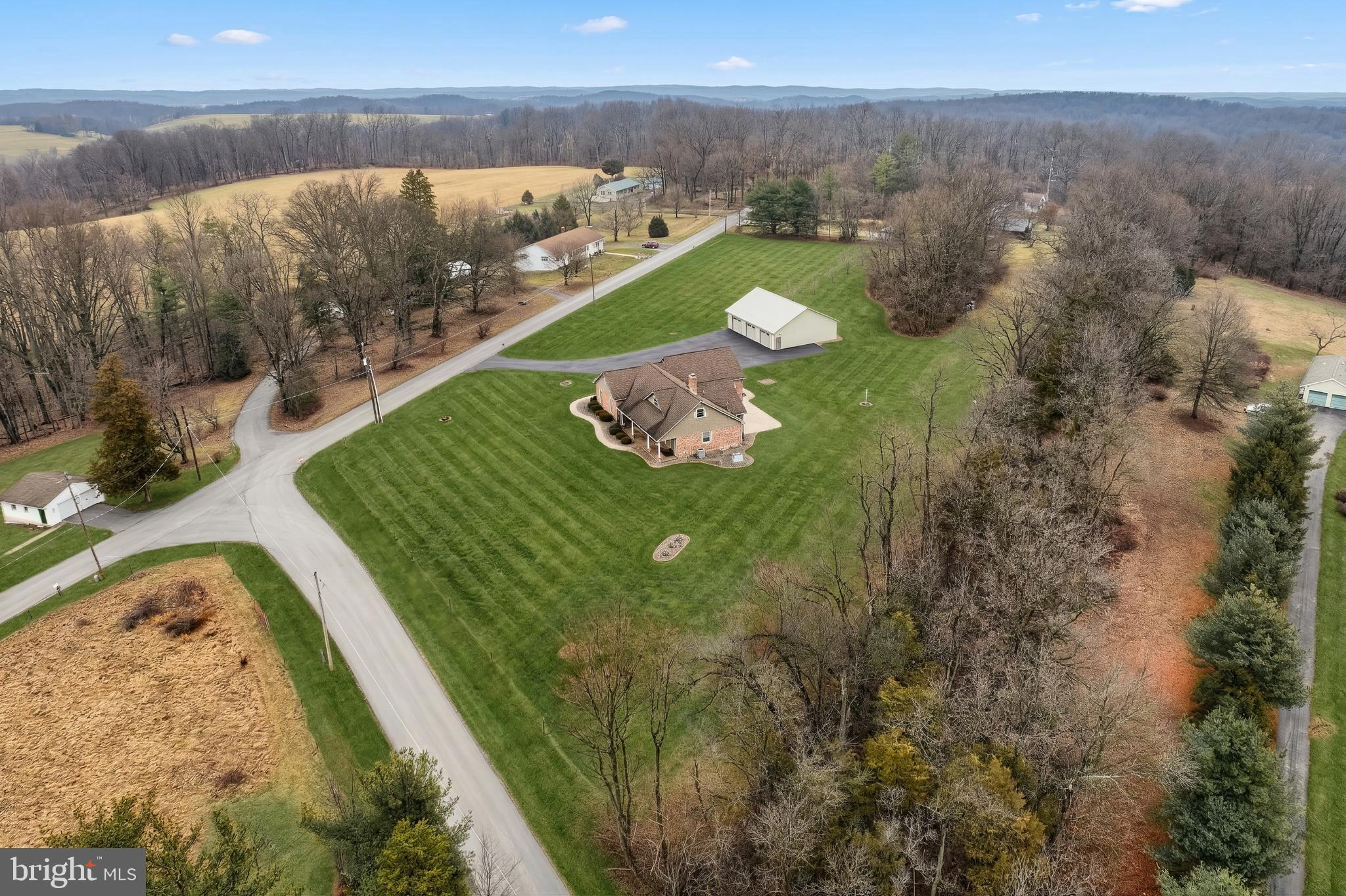 108 Pickett Road Dover, PA 17315 - Photo 10 of 64 a view of a lake in middle of the green forest