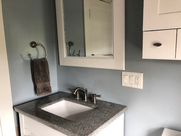 60 Kingsley Road Hull, MA 02045 - Photo 20 of 27 a kitchen with a sink a microwave and cabinets