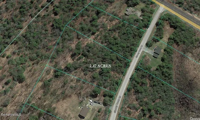 a view of a house with a street