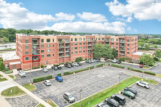 a view of a patio with dining table and chairs with wooden floor