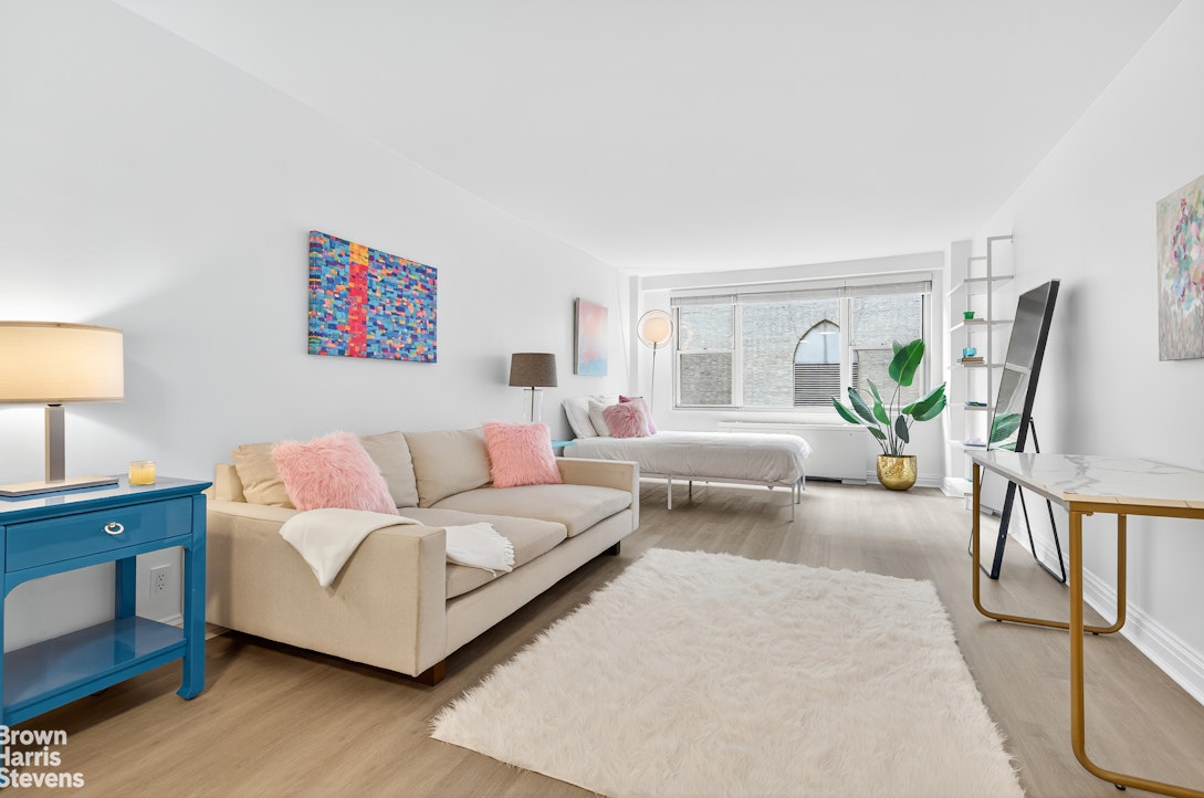 a living room with furniture and a table
