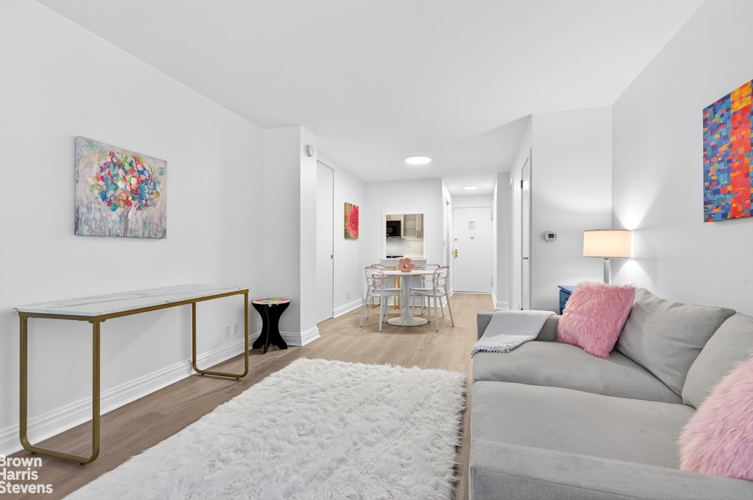 520 East 72nd Street, Unit 4J Manhattan, NY 10021 - Photo 3 of 15 a living room with furniture