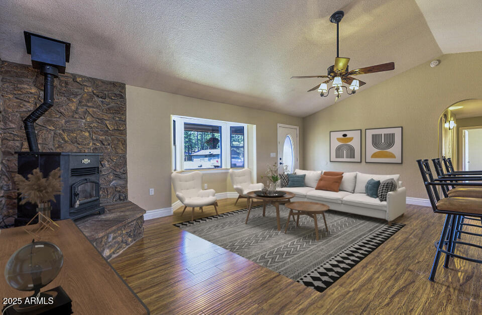 116 Skyhook Road Pinetop, AZ 85935 - Photo 18 of 32 a living room with furniture or couch and a fireplace