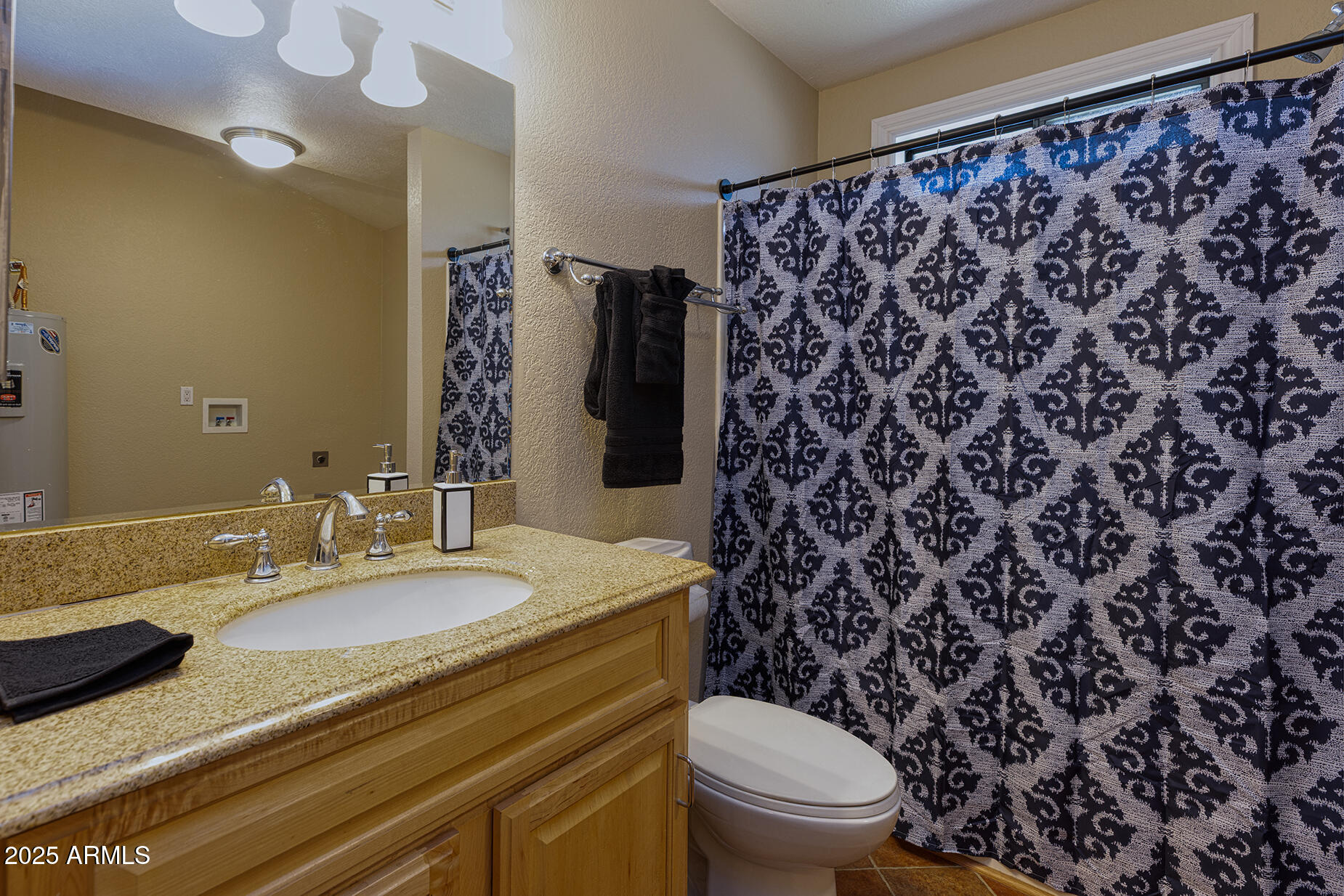 116 Skyhook Road Pinetop, AZ 85935 - Photo 19 of 32 a bathroom with a granite countertop sink and a mirror