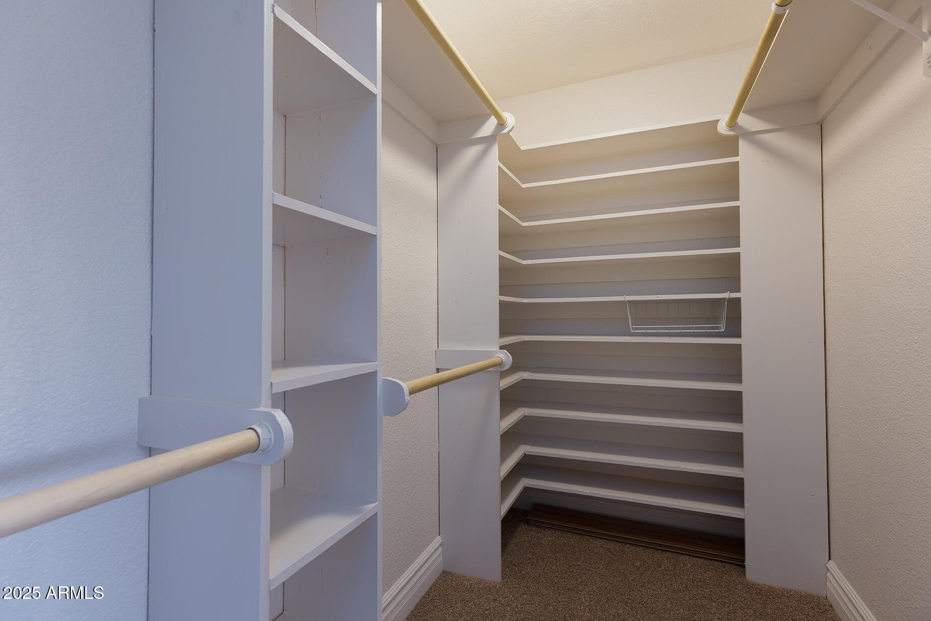 116 Skyhook Road Pinetop, AZ 85935 - Photo 21 of 32 a view of walk in closet with empty racks