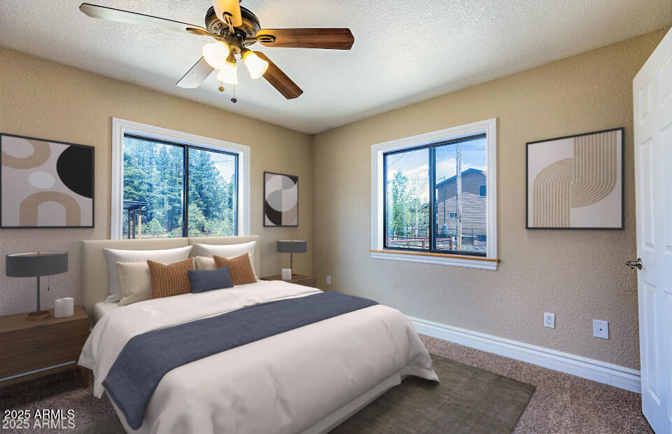 116 Skyhook Road Pinetop, AZ 85935 - Photo 23 of 32 a bedroom with a large bed and a window