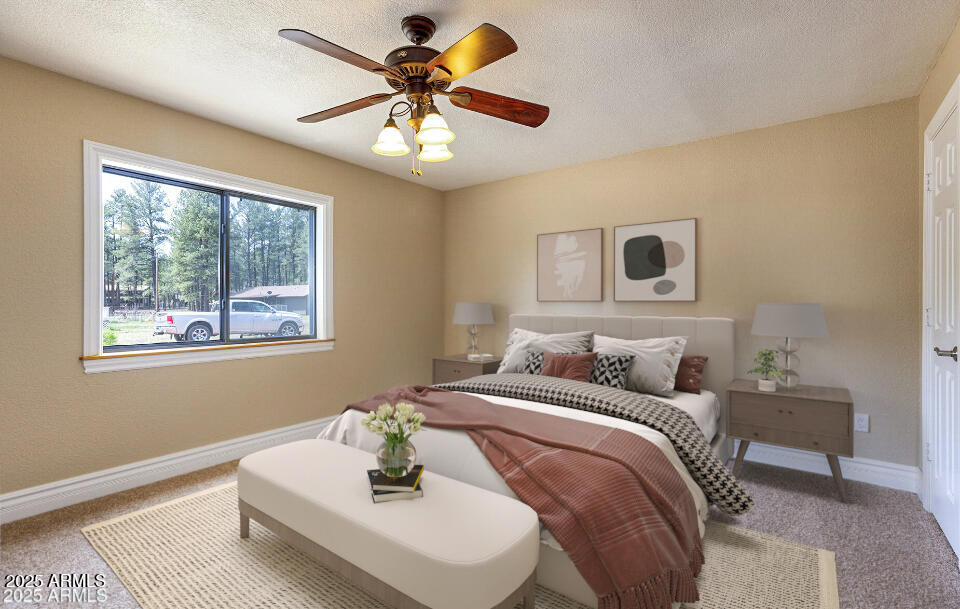 116 Skyhook Road Pinetop, AZ 85935 - Photo 24 of 32 a bedroom with a bed and a chandelier