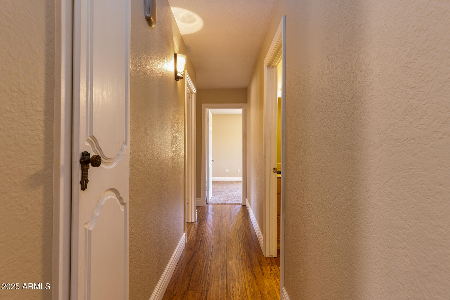 116 Skyhook Road Pinetop, AZ 85935 - Photo 28 of 32 a view of a hallway with wooden floor