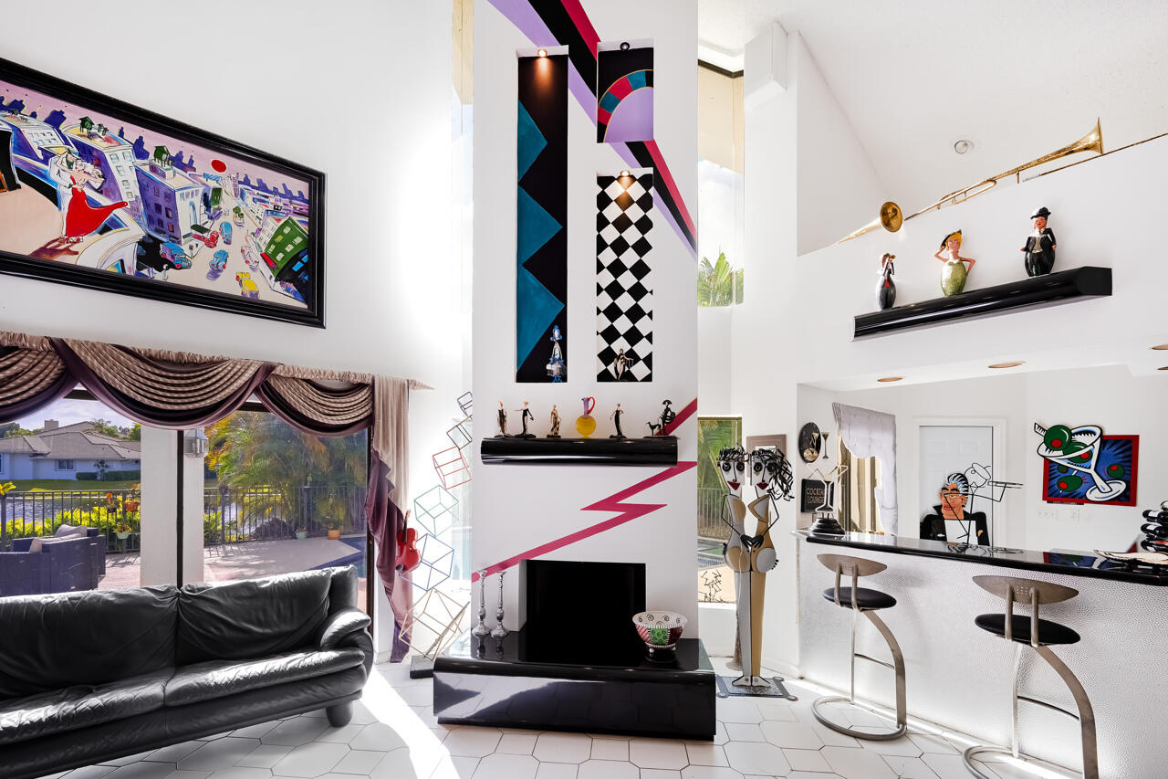 3740 Canterbury Way Boca Raton, FL 33434 - Photo 12 of 55 a living room with furniture and a fireplace