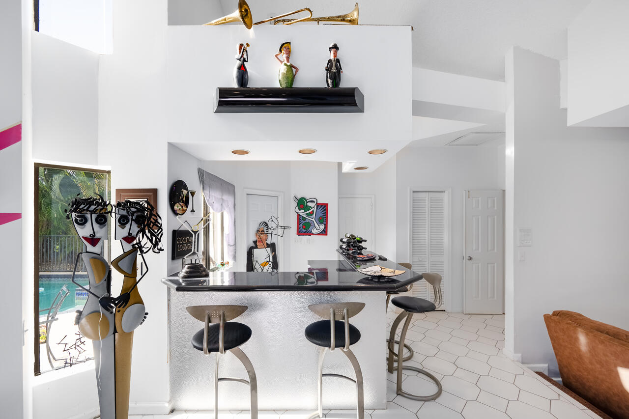 3740 Canterbury Way Boca Raton, FL 33434 - Photo 14 of 55 a view of a dining room with furniture and a kitchen