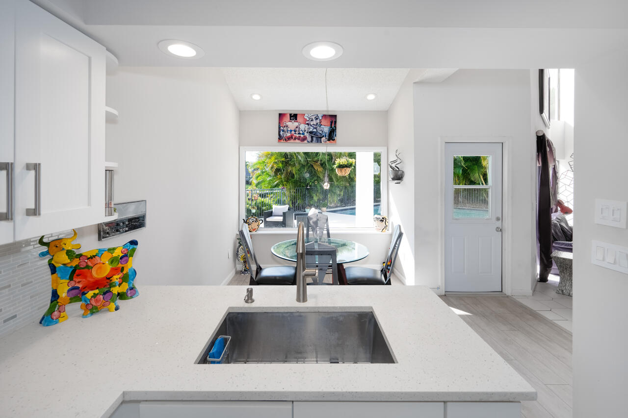3740 Canterbury Way Boca Raton, FL 33434 - Photo 18 of 55 a living room with furniture and a large window