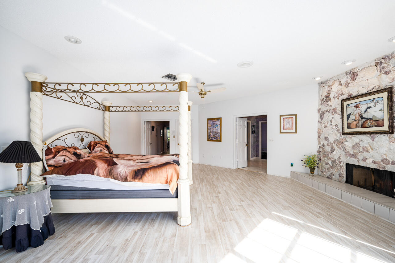 3740 Canterbury Way Boca Raton, FL 33434 - Photo 22 of 55 a living room with furniture and a fireplace