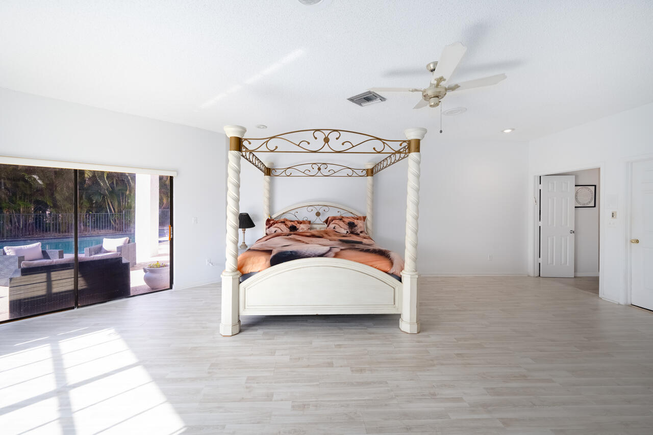 3740 Canterbury Way Boca Raton, FL 33434 - Photo 24 of 55 a view of a livingroom with furniture and chandelier fan