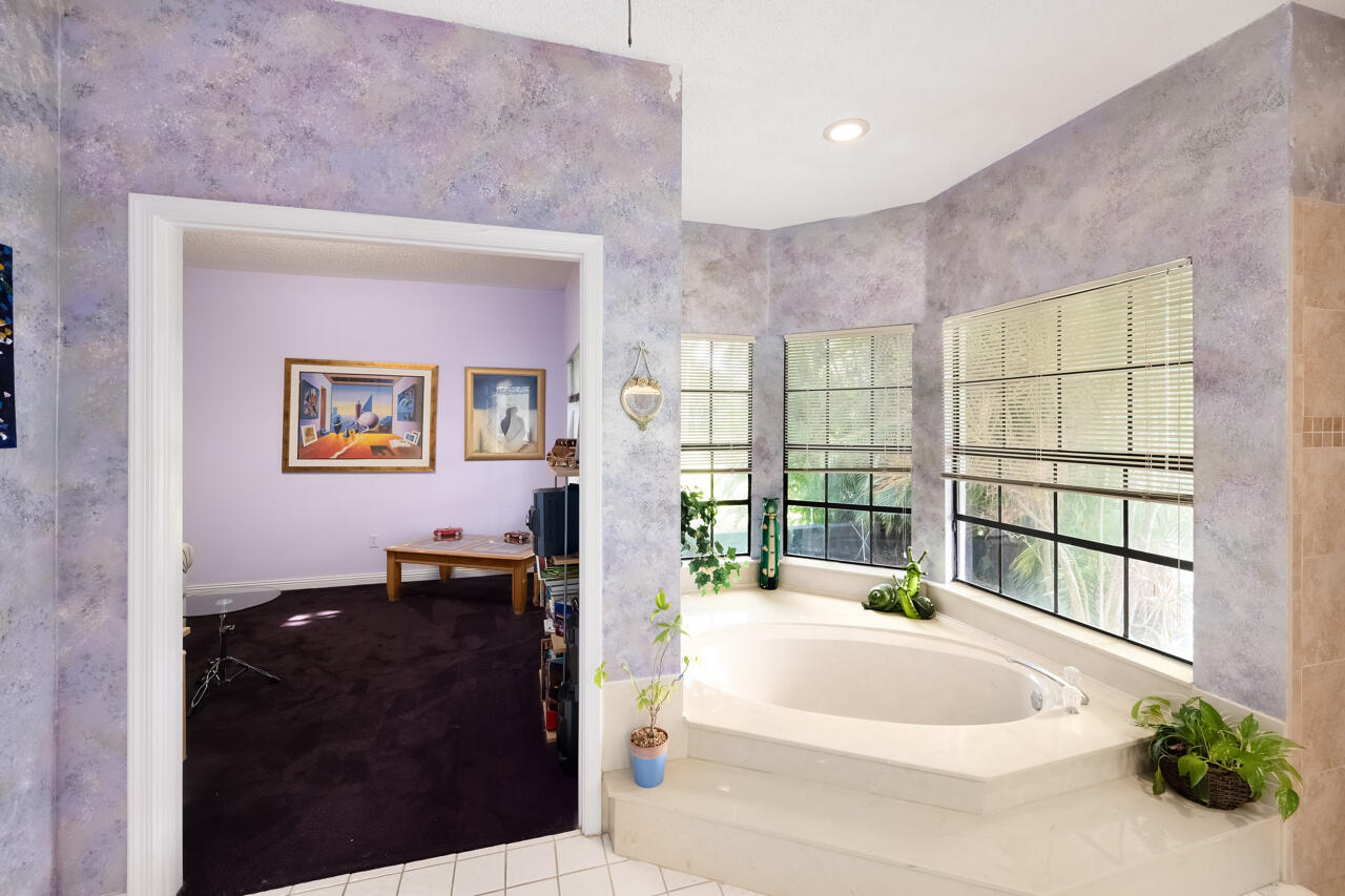 3740 Canterbury Way Boca Raton, FL 33434 - Photo 28 of 55 a large white bed sitting in a room next to a window