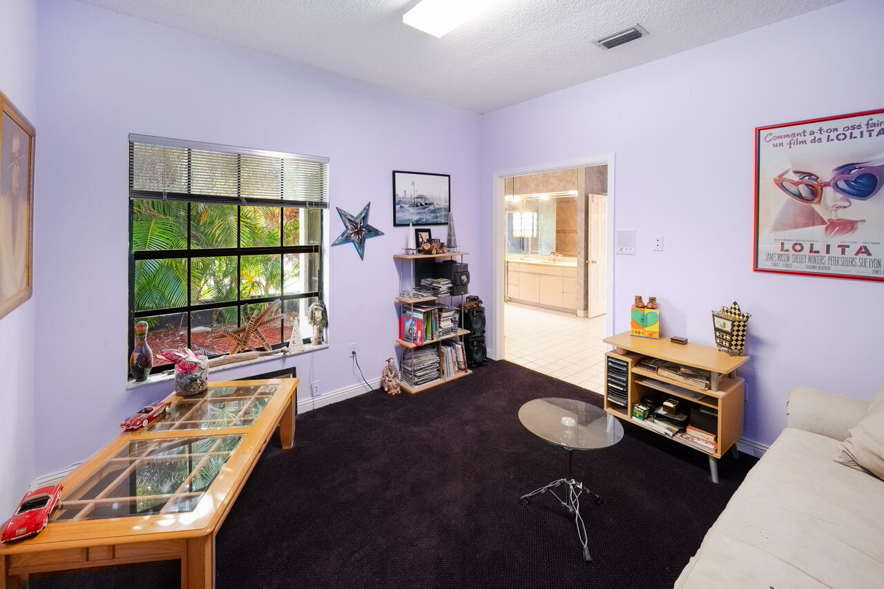 3740 Canterbury Way Boca Raton, FL 33434 - Photo 30 of 55 a room with furniture and a window