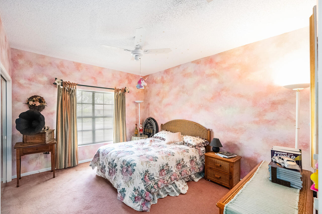 3740 Canterbury Way Boca Raton, FL 33434 - Photo 34 of 55 a bedroom with a bed and dresser