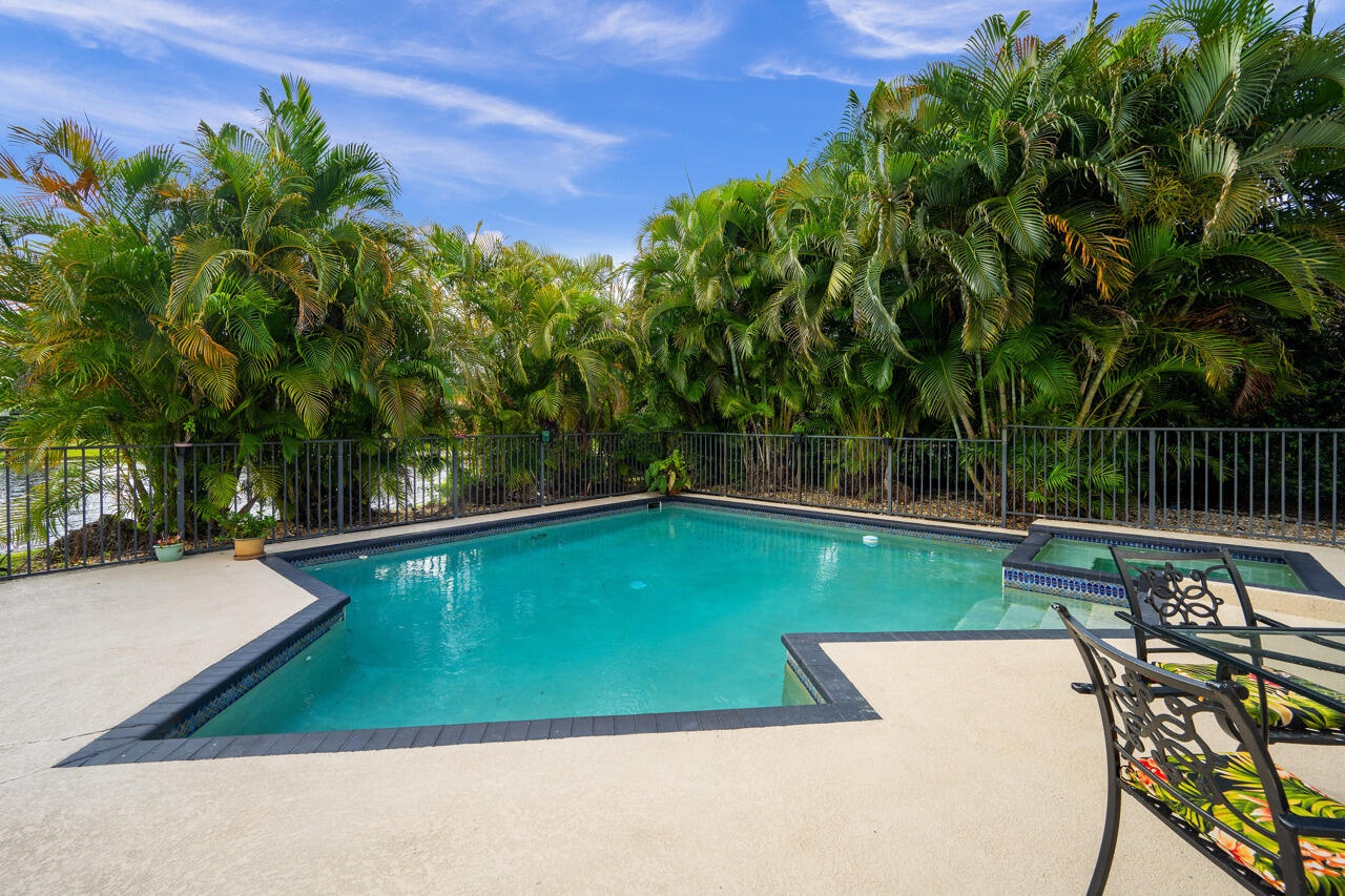 3740 Canterbury Way Boca Raton, FL 33434 - Photo 42 of 55 a view of a swimming pool with a patio