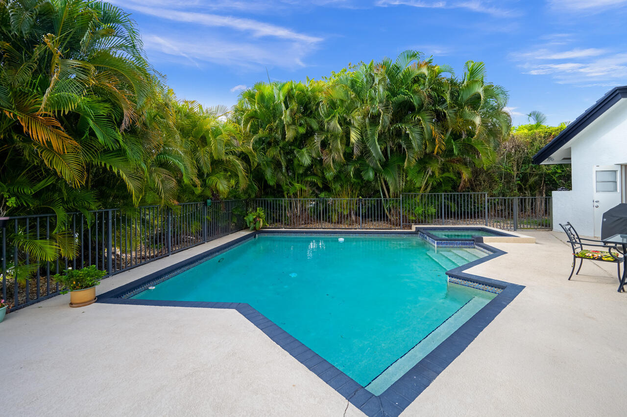 3740 Canterbury Way Boca Raton, FL 33434 - Photo 43 of 55 a view of a backyard with a slide