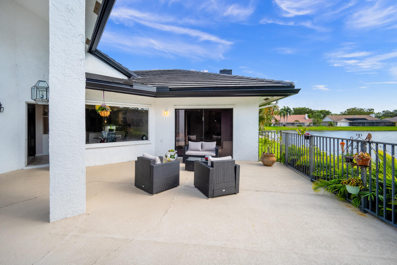 3740 Canterbury Way Boca Raton, FL 33434 - Photo 44 of 55 a view of a patio with couches and potted plants