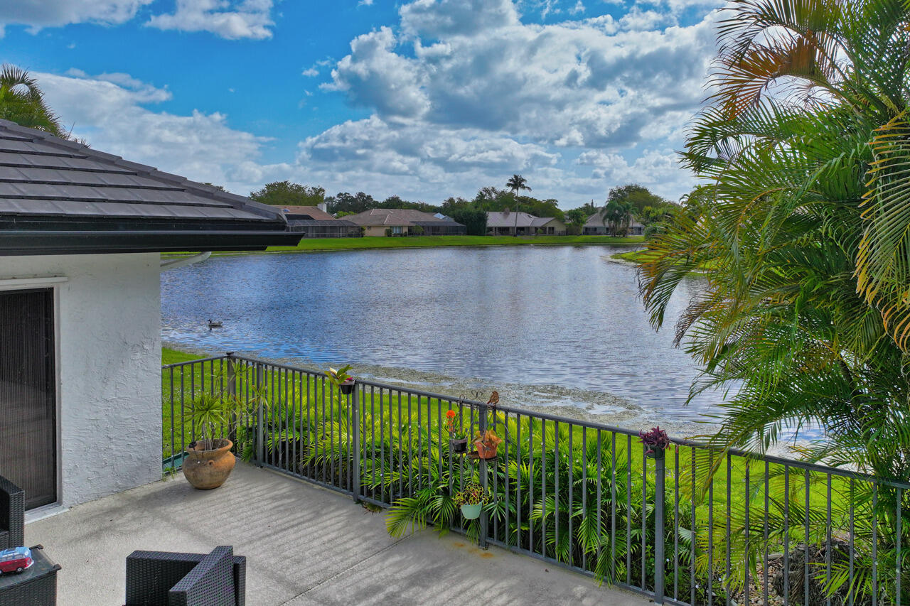 3740 Canterbury Way Boca Raton, FL 33434 - Photo 46 of 55 a view of a garden with a chair
