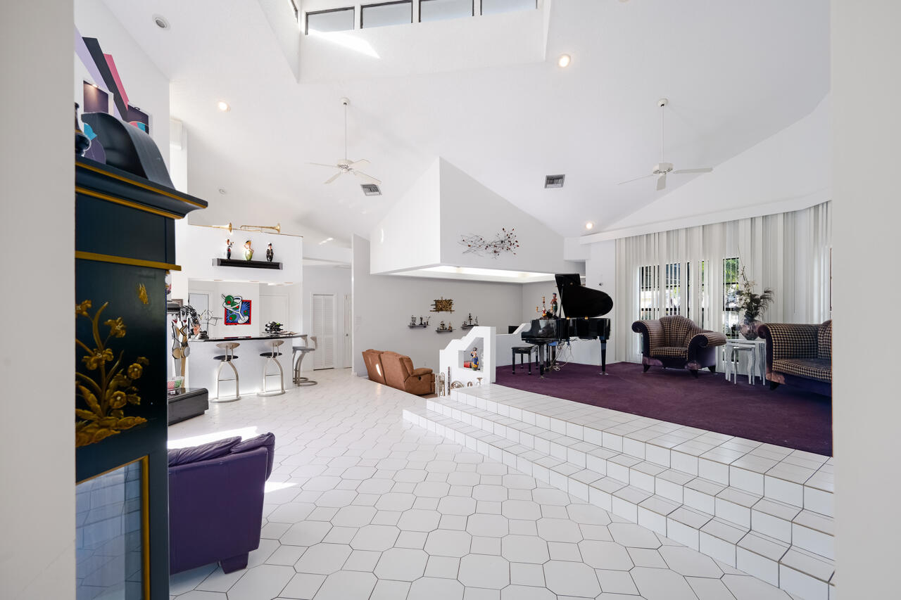 3740 Canterbury Way Boca Raton, FL 33434 - Photo 9 of 55 a living room with furniture and a wooden floor