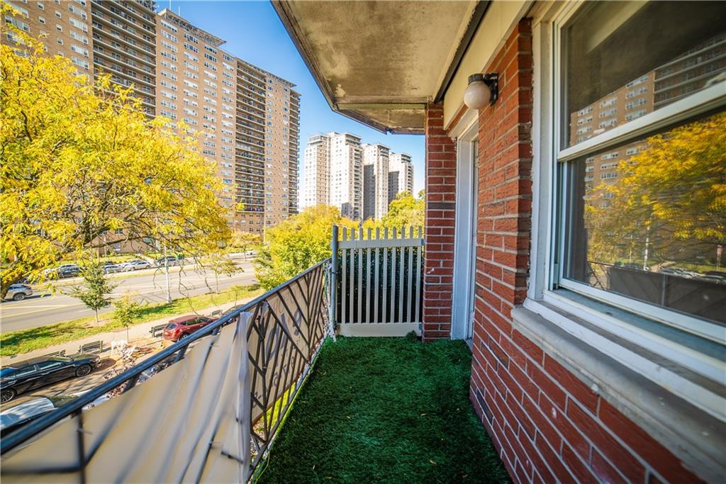 2963 Ocean Parkway, Unit 3F Brooklyn, NY 11235 - Photo 12 of 16 a view of balcony with wooden floor and fence