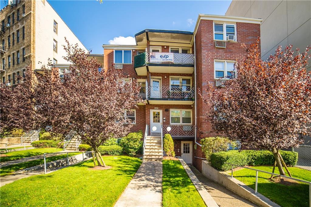 2963 Ocean Parkway, Unit 3F Brooklyn, NY 11235 - Photo 15 of 16 a front view of a house with a yard