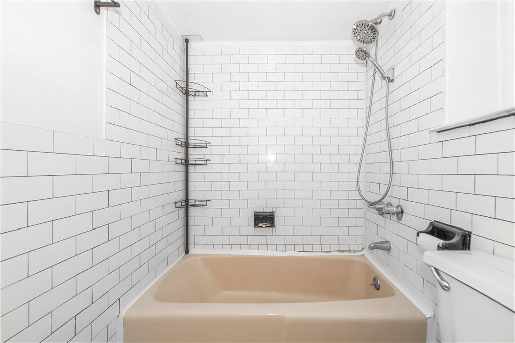 2963 Ocean Parkway, Unit 3F Brooklyn, NY 11235 - Photo 6 of 16 a bathroom with a bathtub