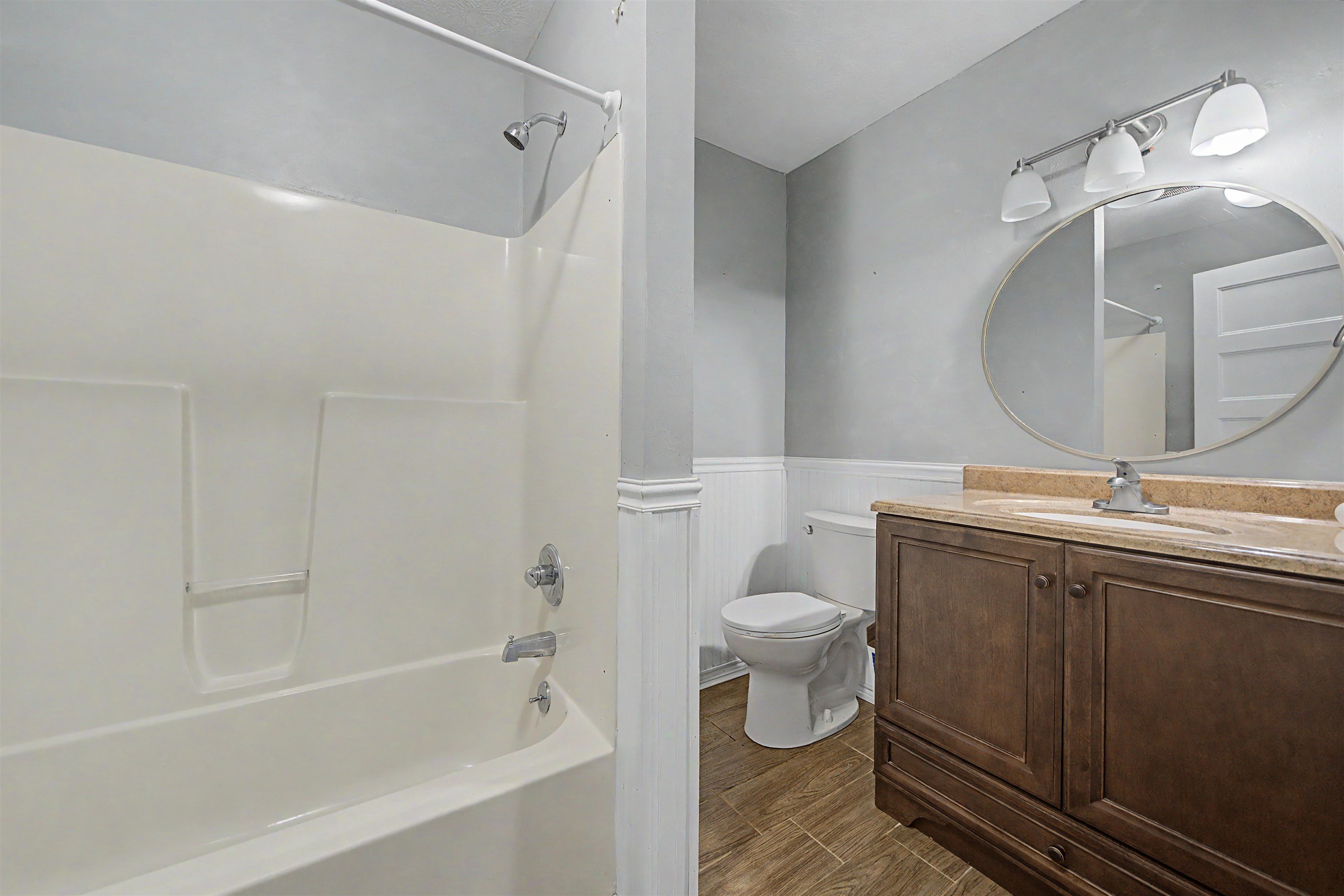 436 Skyline Road Selmer, TN 38375 - Photo 23 of 40 Bathroom featuring a wood-finish vanity with an integrated sink and a light-toned countertop