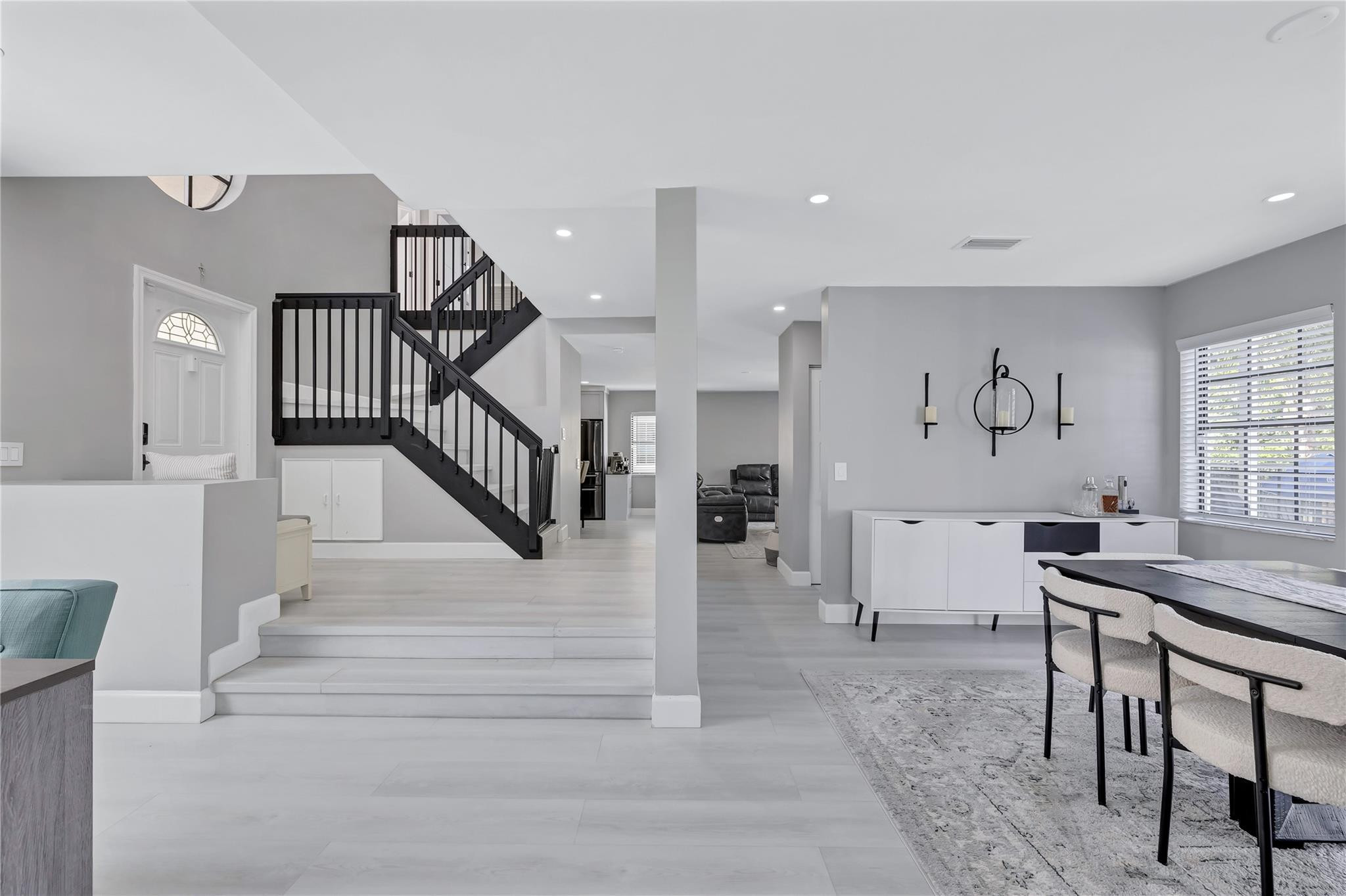 8613 Windy Circle Boynton Beach, FL 33472 - Photo 11 of 51 a view of a hallway with furniture and a large window