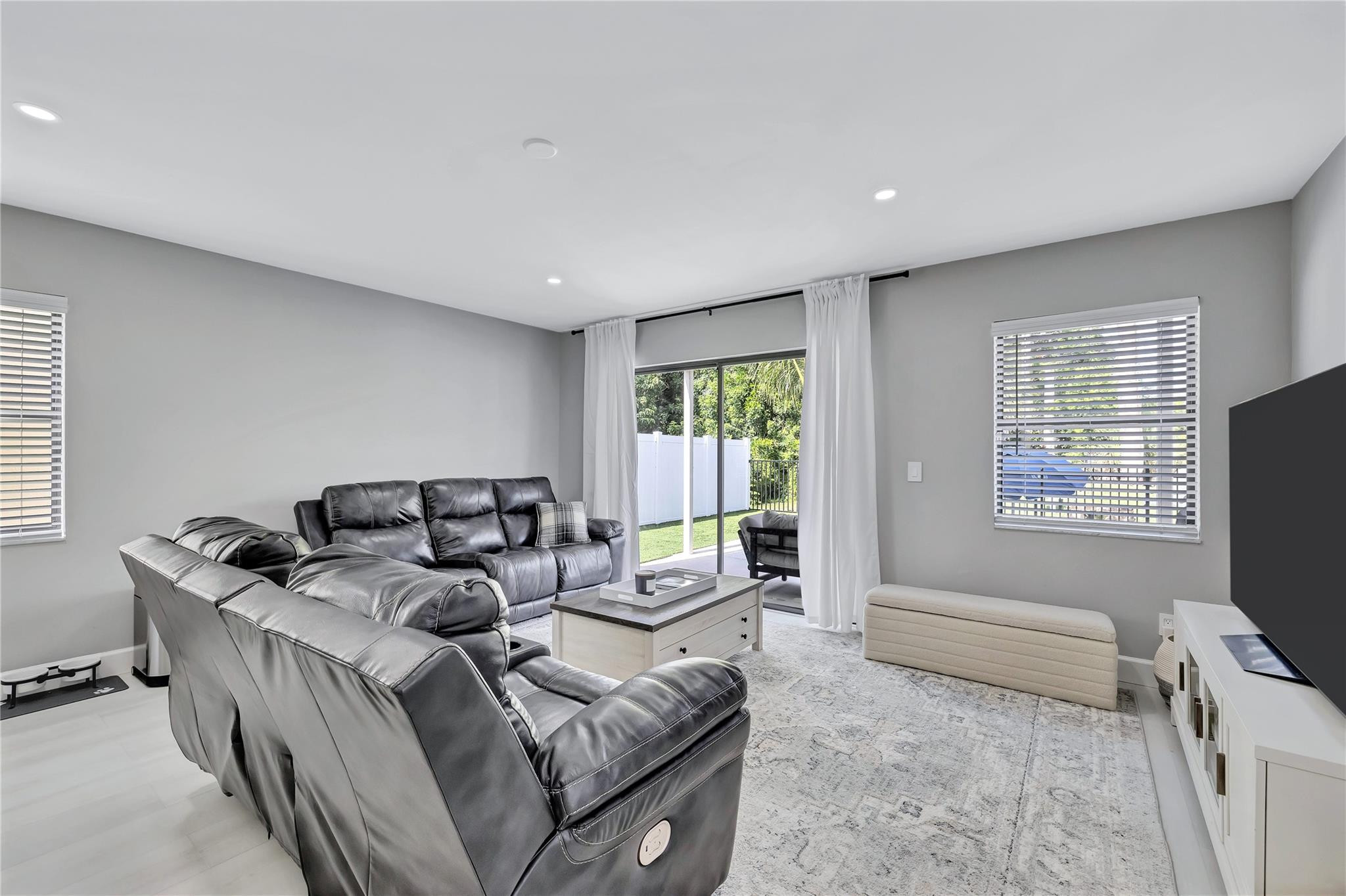 8613 Windy Circle Boynton Beach, FL 33472 - Photo 13 of 51 a living room with furniture and a flat screen tv